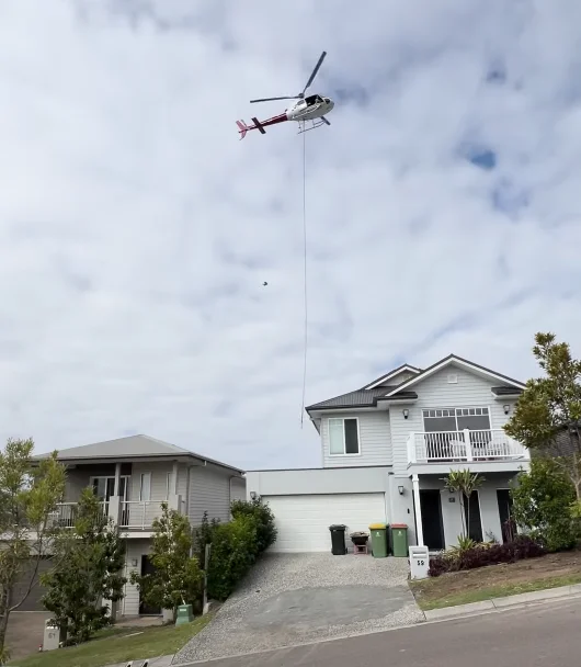Helicopter lifting pool over Spring Mountain